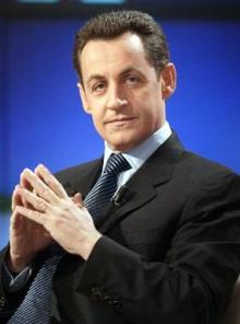 Nicholas Sarkozy displaying confidence with his hands